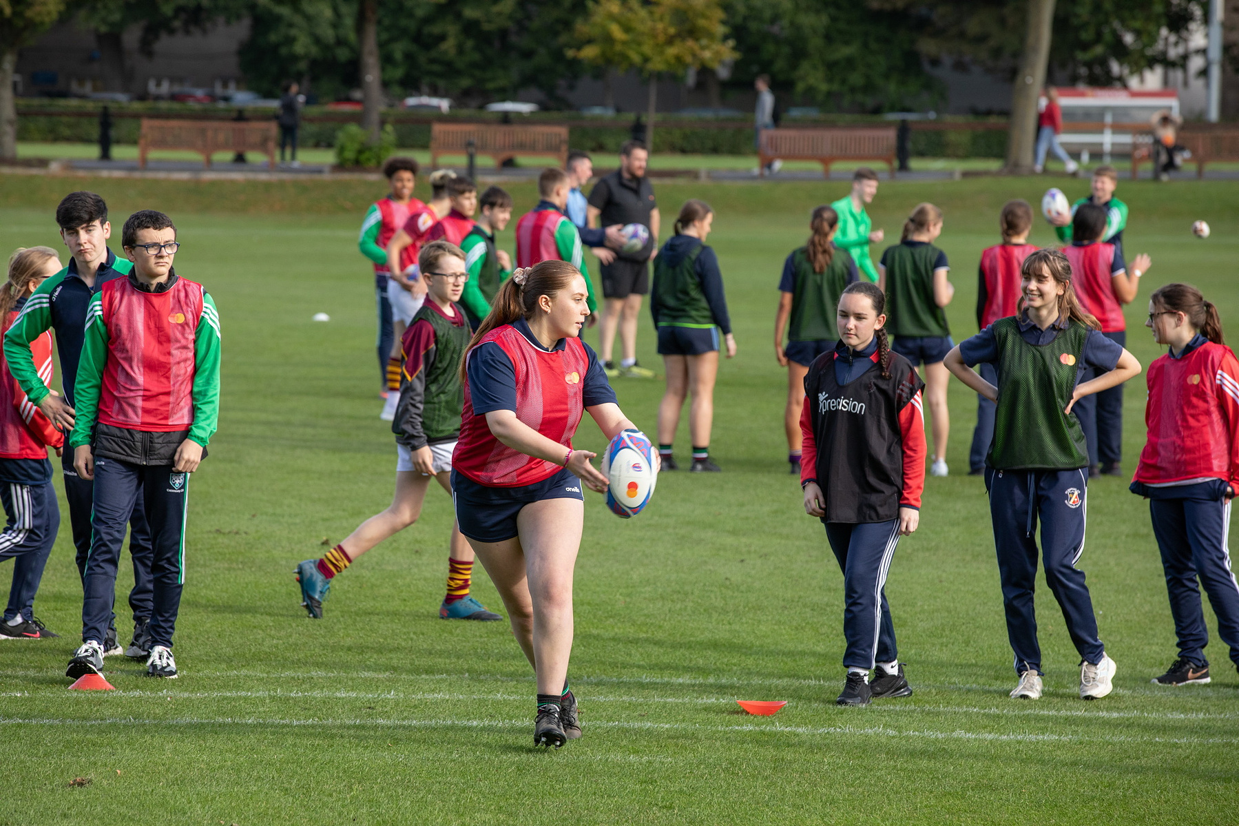 Sene Naoupu pictured at a training session for local children at Trinity College, Dublin. Mastercard Future of Rugby Report. Corporate event photographer www.1image.ie