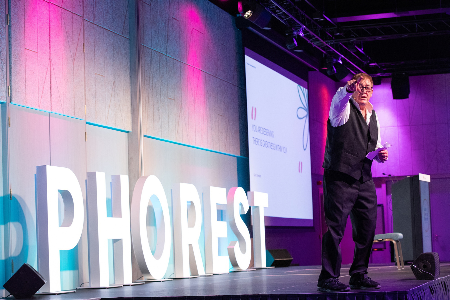 Live Event photography Dubin, male speaker on stage at Salon Owners Summit 2024 in Dublin Royal Convention Centre
