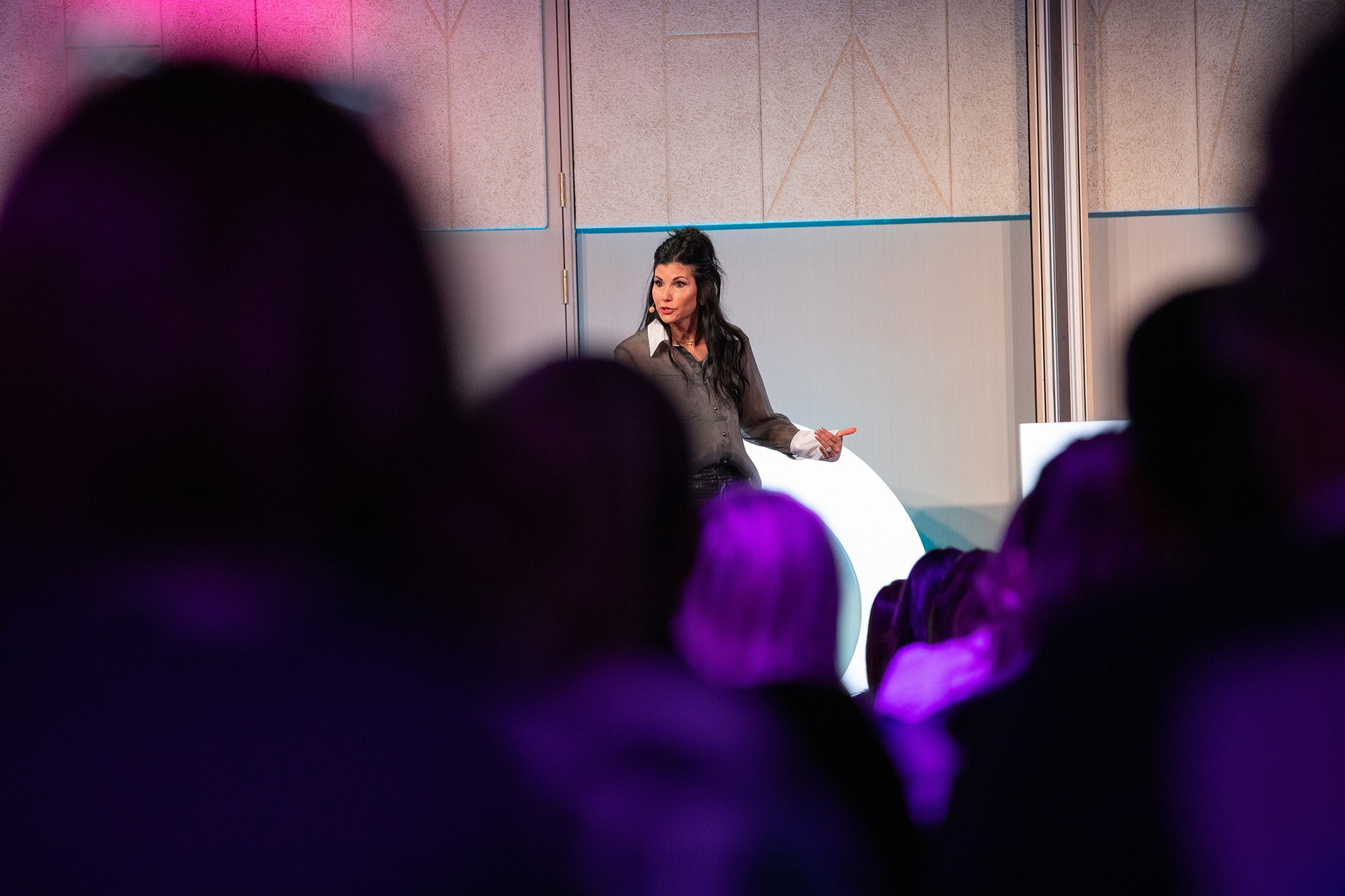 Live Event photography Dubin, female speaker on stage at Salon Owners Summit 2024 in Dublin Royal Convention Centre