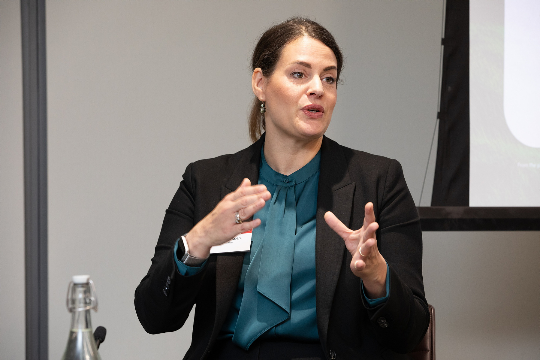 Event photo of  female speaker addressing attendees at The Legal 500, Green Summit Ireland 2023 at Matheson LLP Dublin. Corporate event photography www.eventimage.ie
