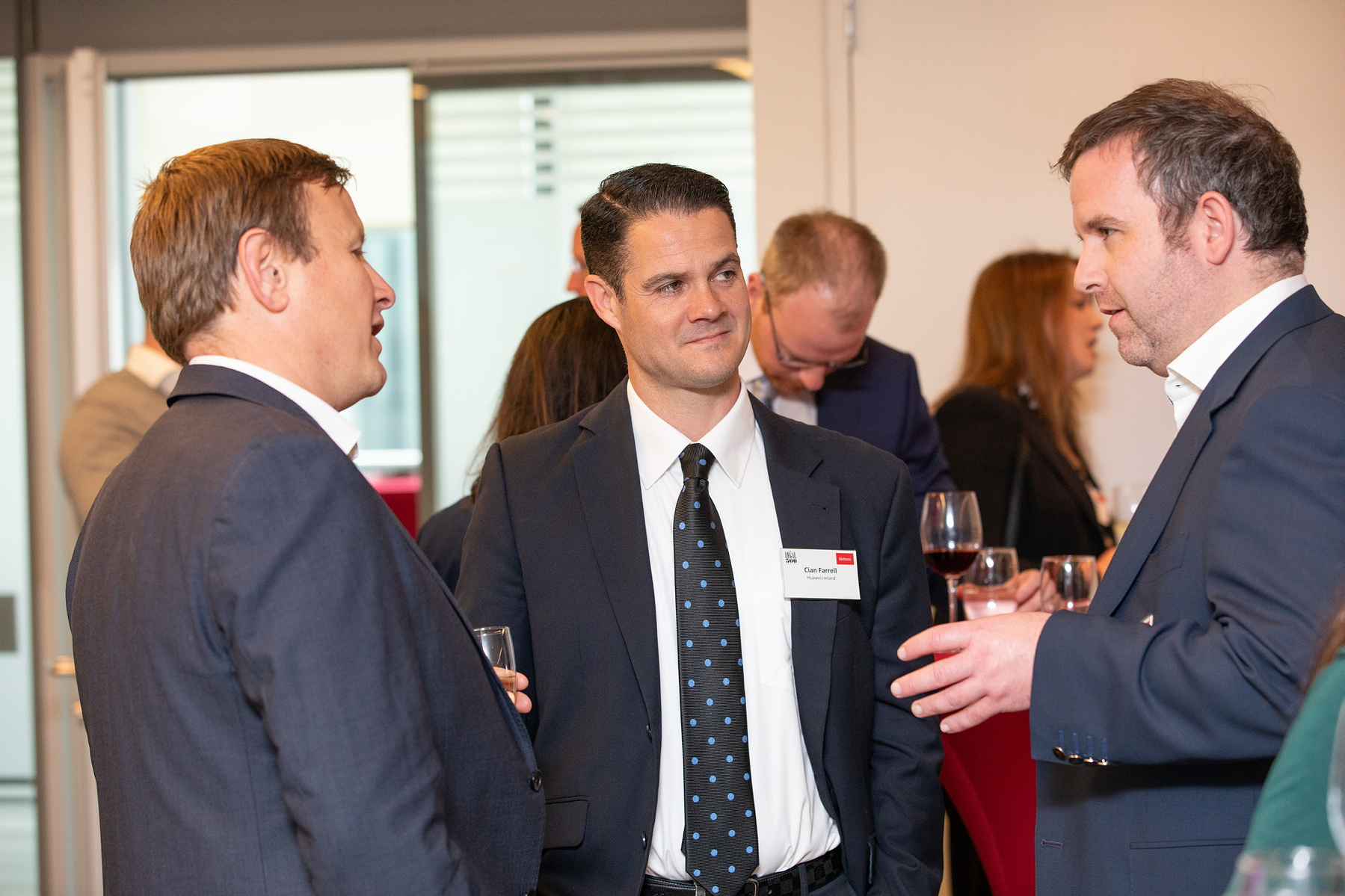 Corporate event group of men chatting