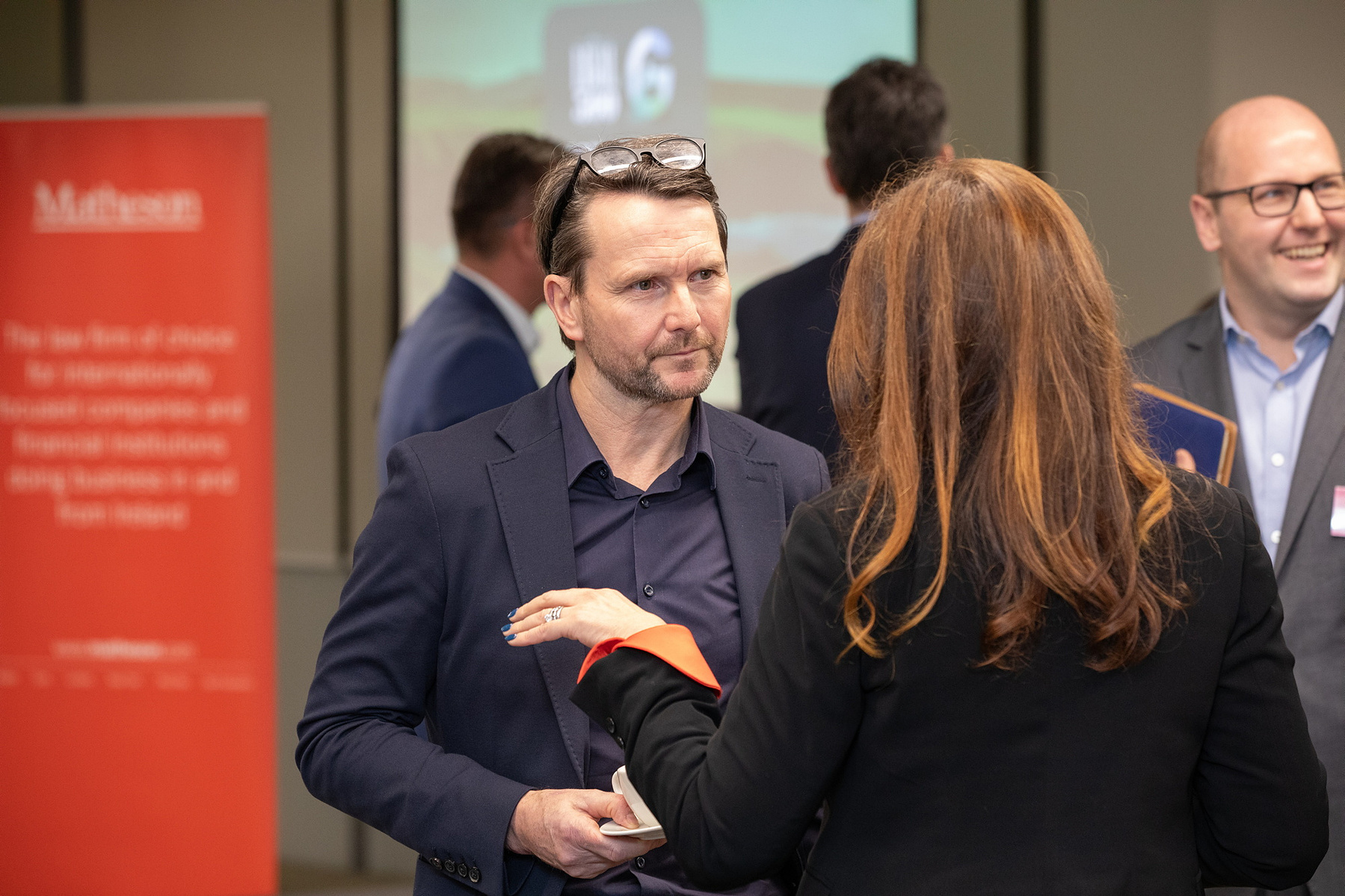 Event photo of attendees networking at The Legal 500, Green Summit Ireland 2023 at Matheson LLP Dublin. Corporate event photography www.eventimage.ie