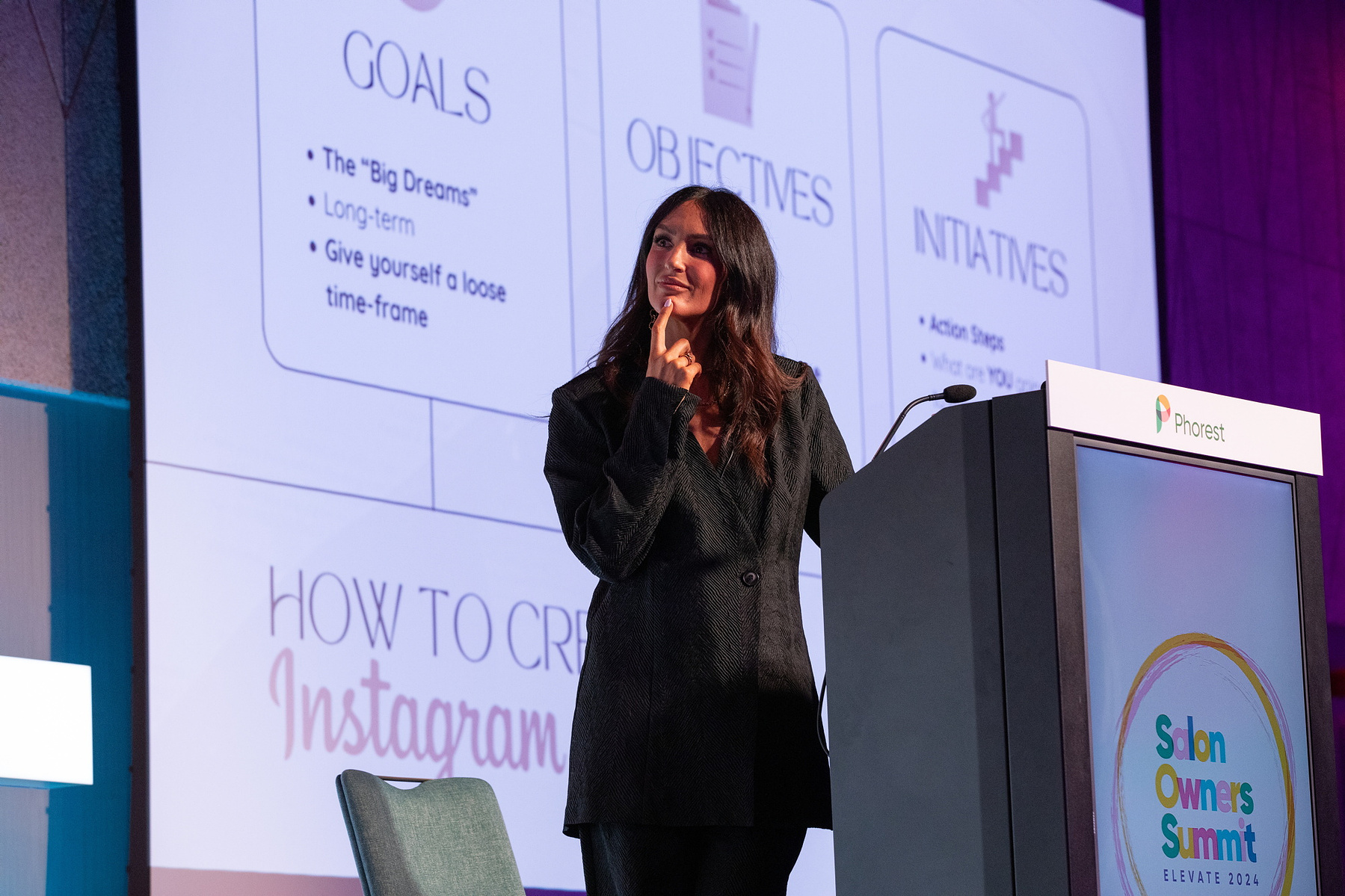Live Event photography Dubin, female speaker on stage at Salon Owners Summit 2024 in Dublin Royal Convention Centre