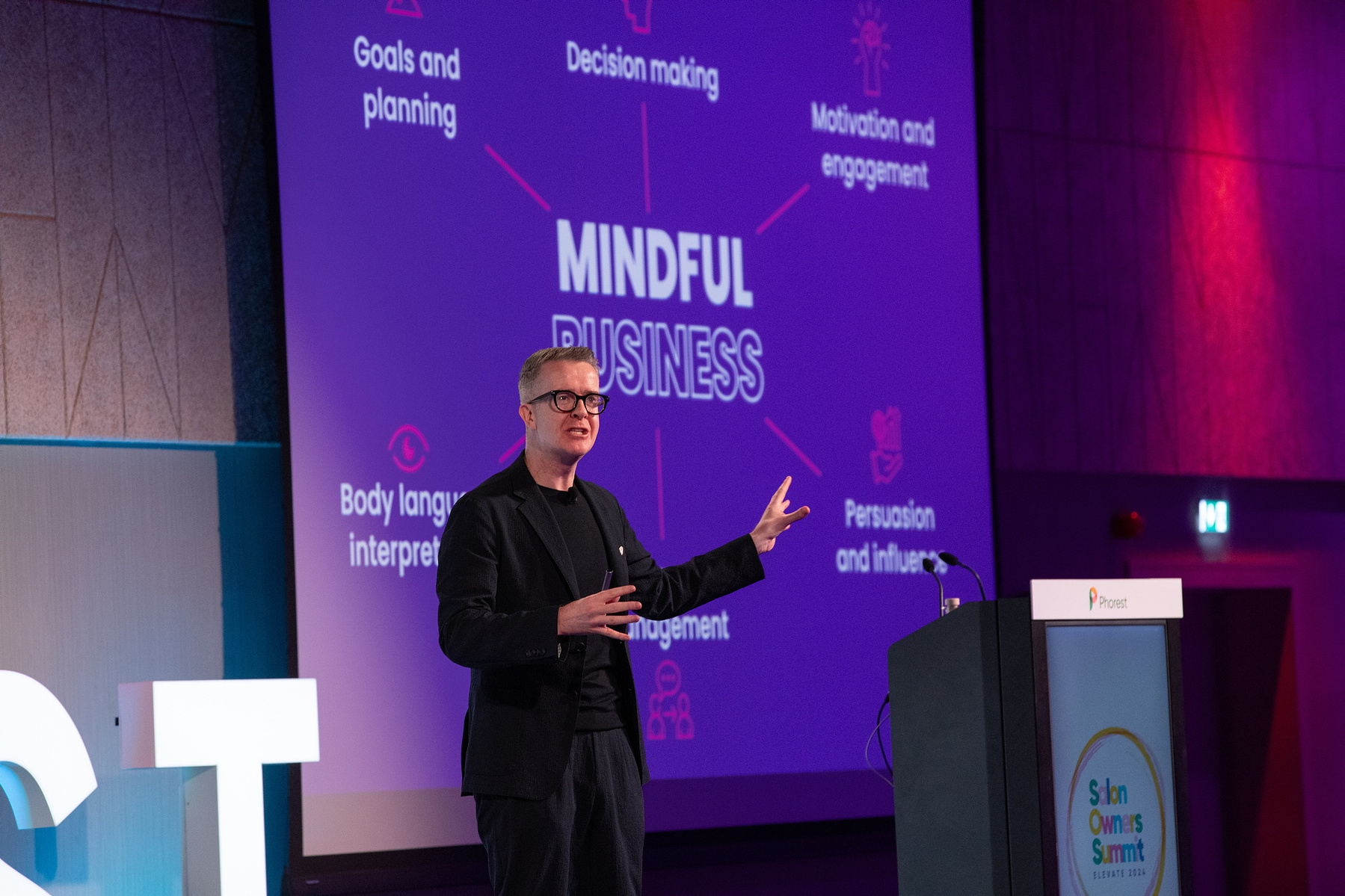 Live Event photography Dubin, male speaker on stage at Salon Owners Summit 2024 in Dublin Royal Convention Centre