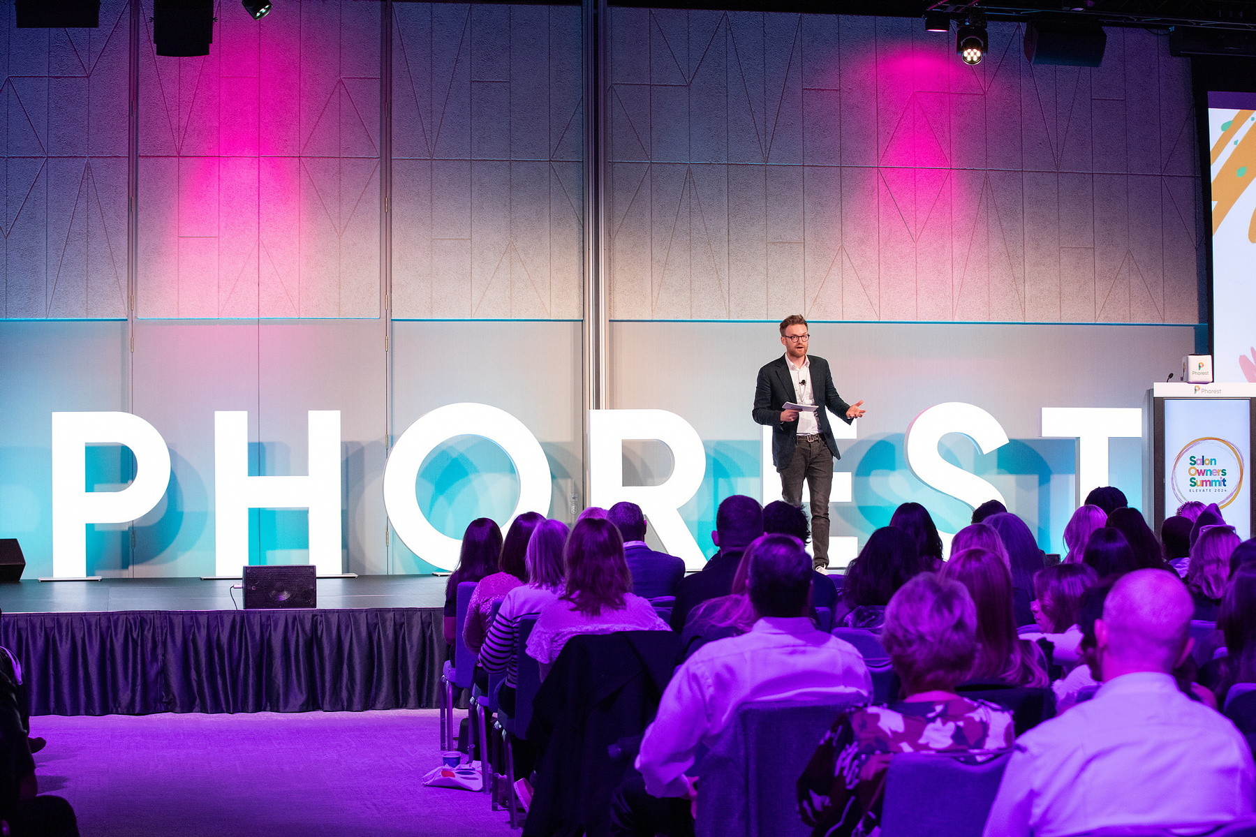 Live Event photography Dubin, male speaker on stage at Salon Owners Summit 2024 in Dublin Royal Convention Centre