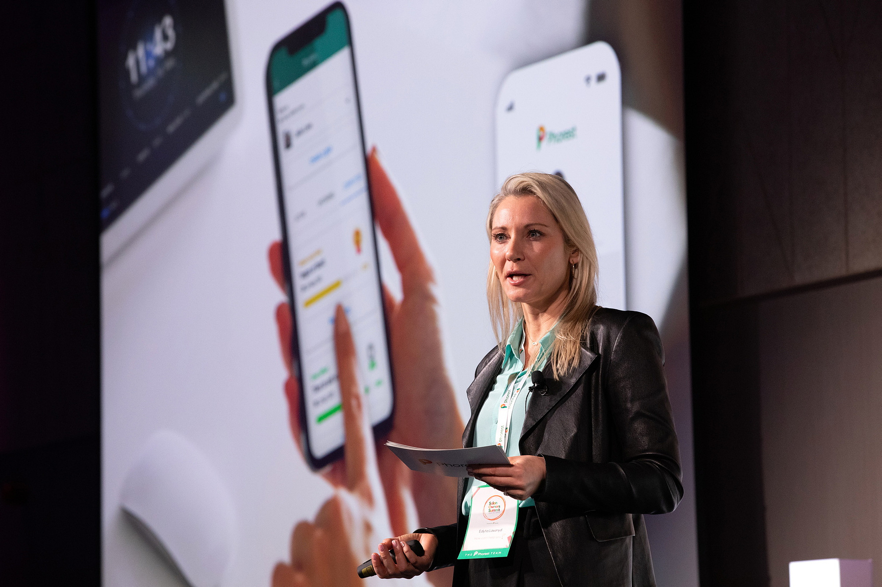 Event photographer Dubin, female speaker on stage at Salon Owners Summit 2023 in Dublin Royal Convention Centre