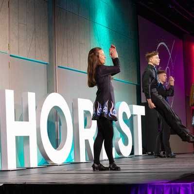 Irish dancers on stage at a live event in Dublin captured by a professional event photographer 
