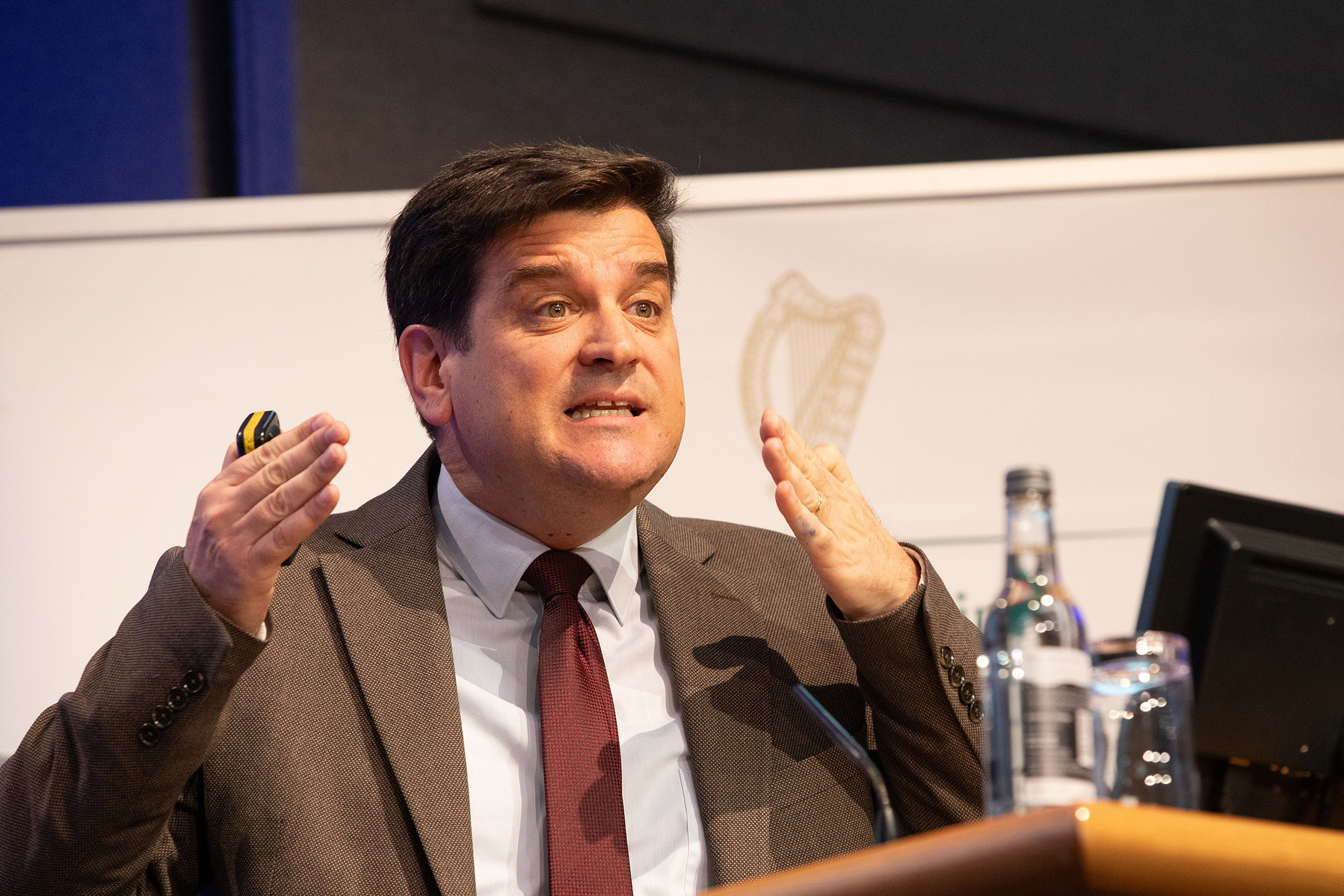 Conference event photo of a male speaker at The Health and Social Care Conference in Dublin Castle.  Corporate Event Photographer Dublin 