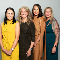 Corporate social event group photo of co-workers against a grey studio background. Photo printed onsite at the event www.eventimage.ie