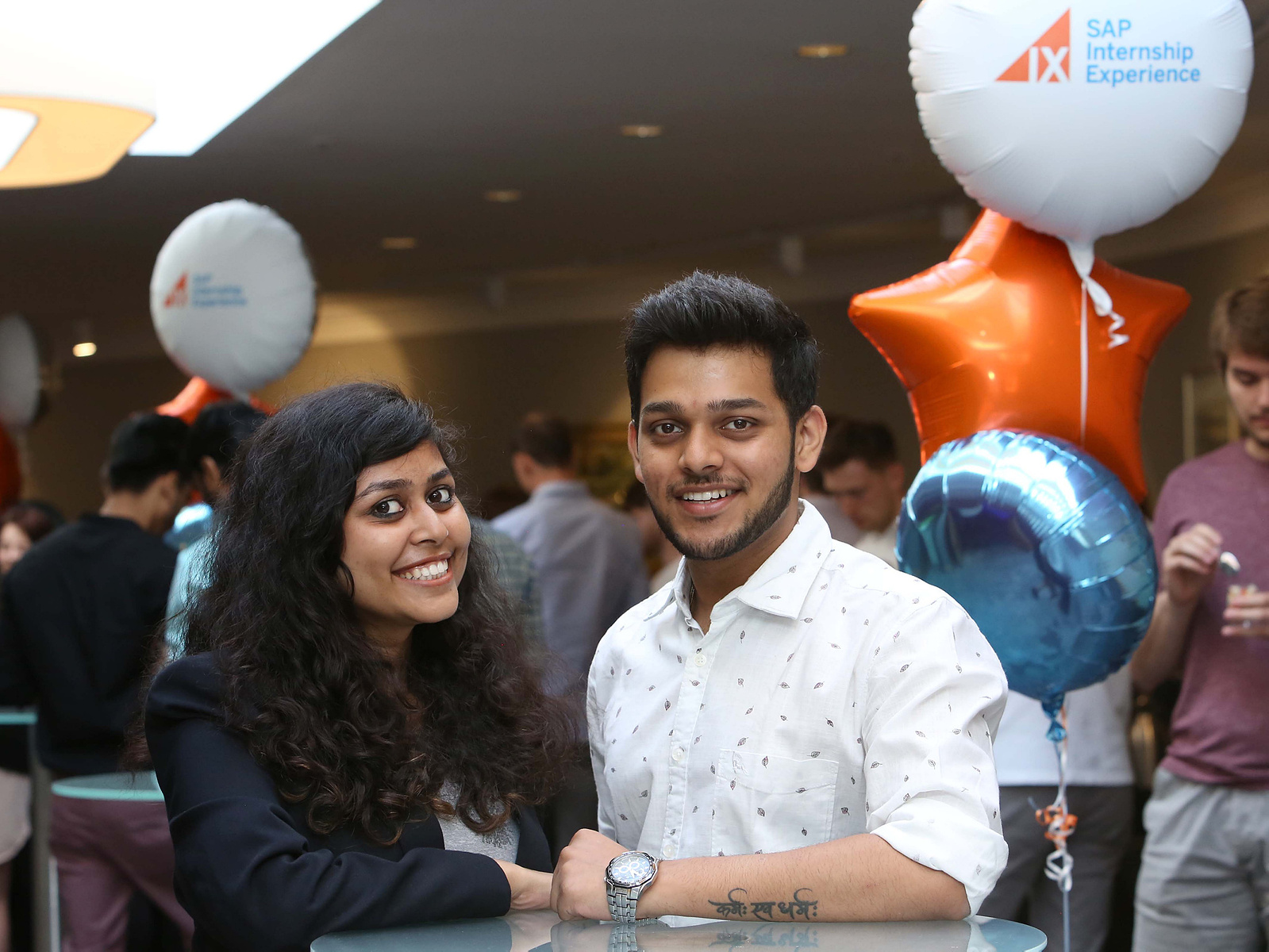 Professional photo of 2 delegates smiling at a live corporate event in Dublin Ireland 