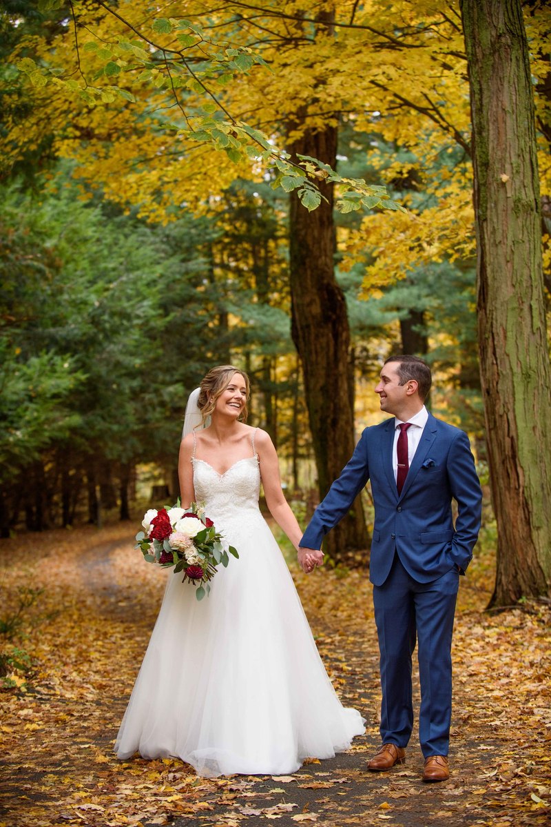 Bride and groom walking. fall wedding Rochester NY