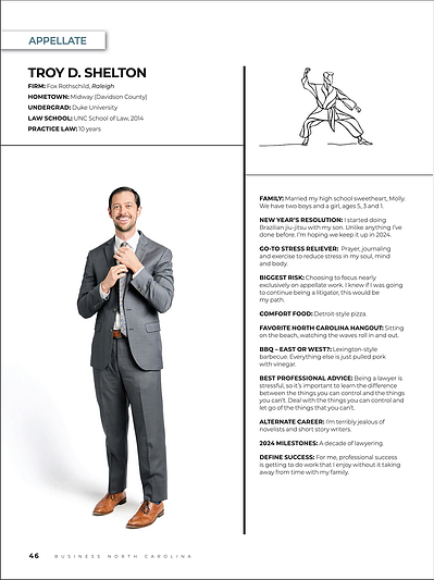 Business North Carolina - Legal Elite editorial of man and Suit, smiling, holding his tie.