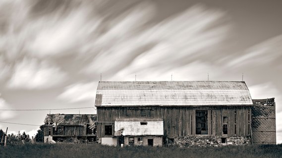 Black and white photo of an old barn