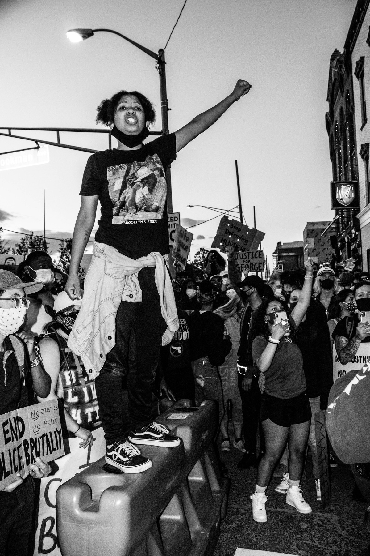 A protestor standing on a barricade in Asbury Park, NJ.