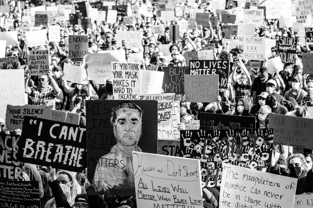 The crowd of protestors raising signs in Asbury Park, NJ.