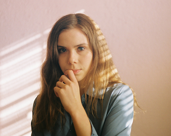 Film portait of Maren Hill, musician, with angular window light