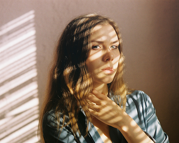 Film portait of Maren Hill, musician, with angular window light