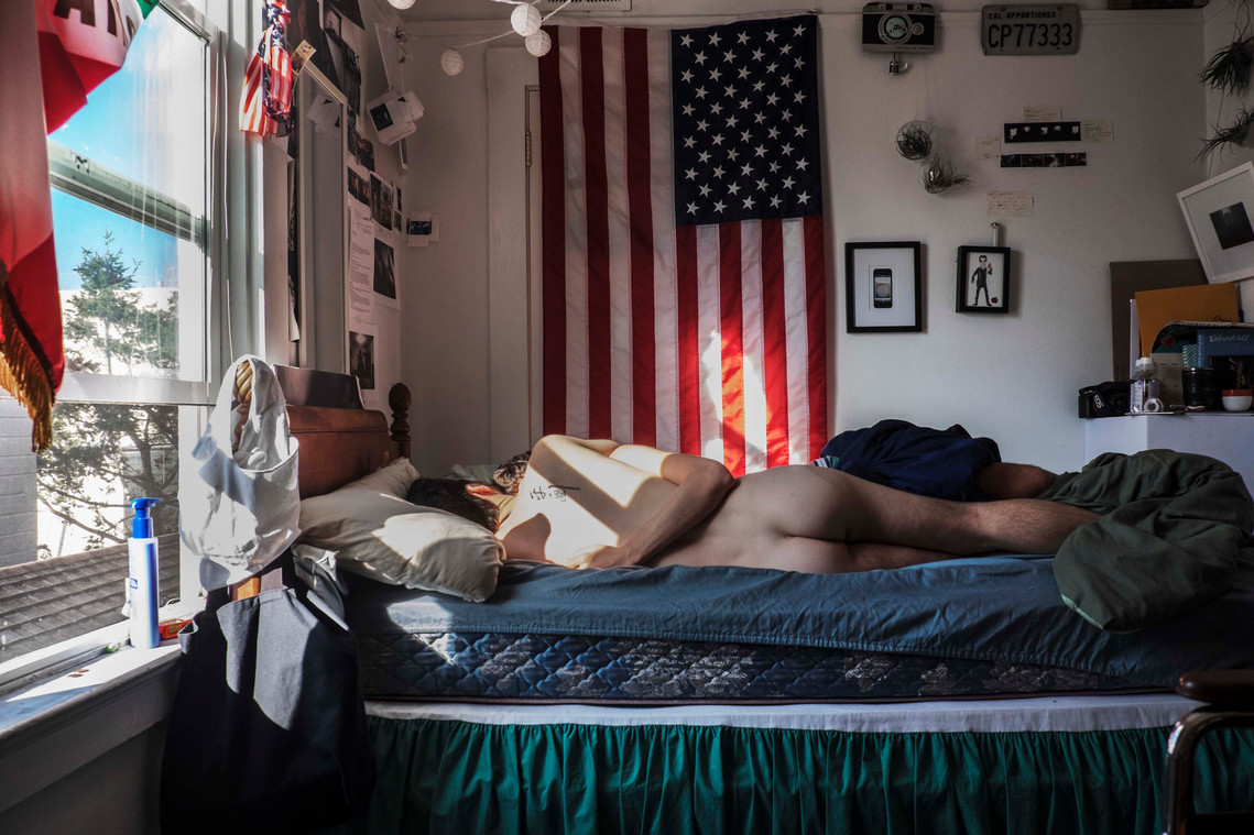 queer love gay cuddles san francisco California gay american flag 