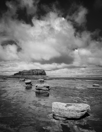 Cloud formations above Saltwick Nab, Saltwick Bay near Whitby on the North Yorkshire coast. A photograph by Tim Pearson.