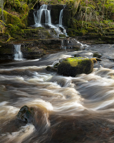 A small waterfall cascades into Straw Beck above Muker in Swaledale, Yorkshire Dales. A photograph by Tim Pearson.