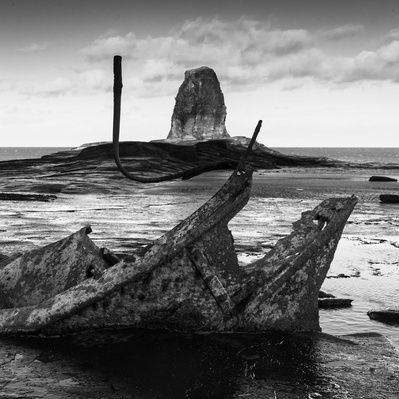 Black Nab rock framed by the wreck of the Admiral Von Tromp, Saltwick Bay, North Yorkshire, UK. A photograph by Tim Pearson.