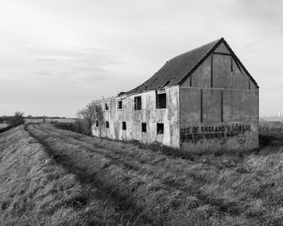 An abandoned and decaying building on the banks of the Humber Estuary at Goxhill Haven, North Lincolnshire. A photograph by Tim Pearson.