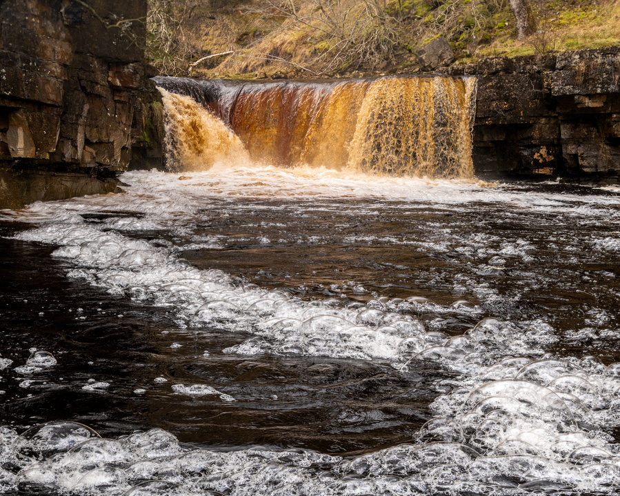 Bubbles flow from Upper Kidson Force, Keld, North Yorkshire. A photograph by Tim Pearson.