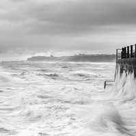 A choppy tide hits the sea wall at Sandsend, near Whitby in North Yorkshire. A photograph by Tim Pearson.