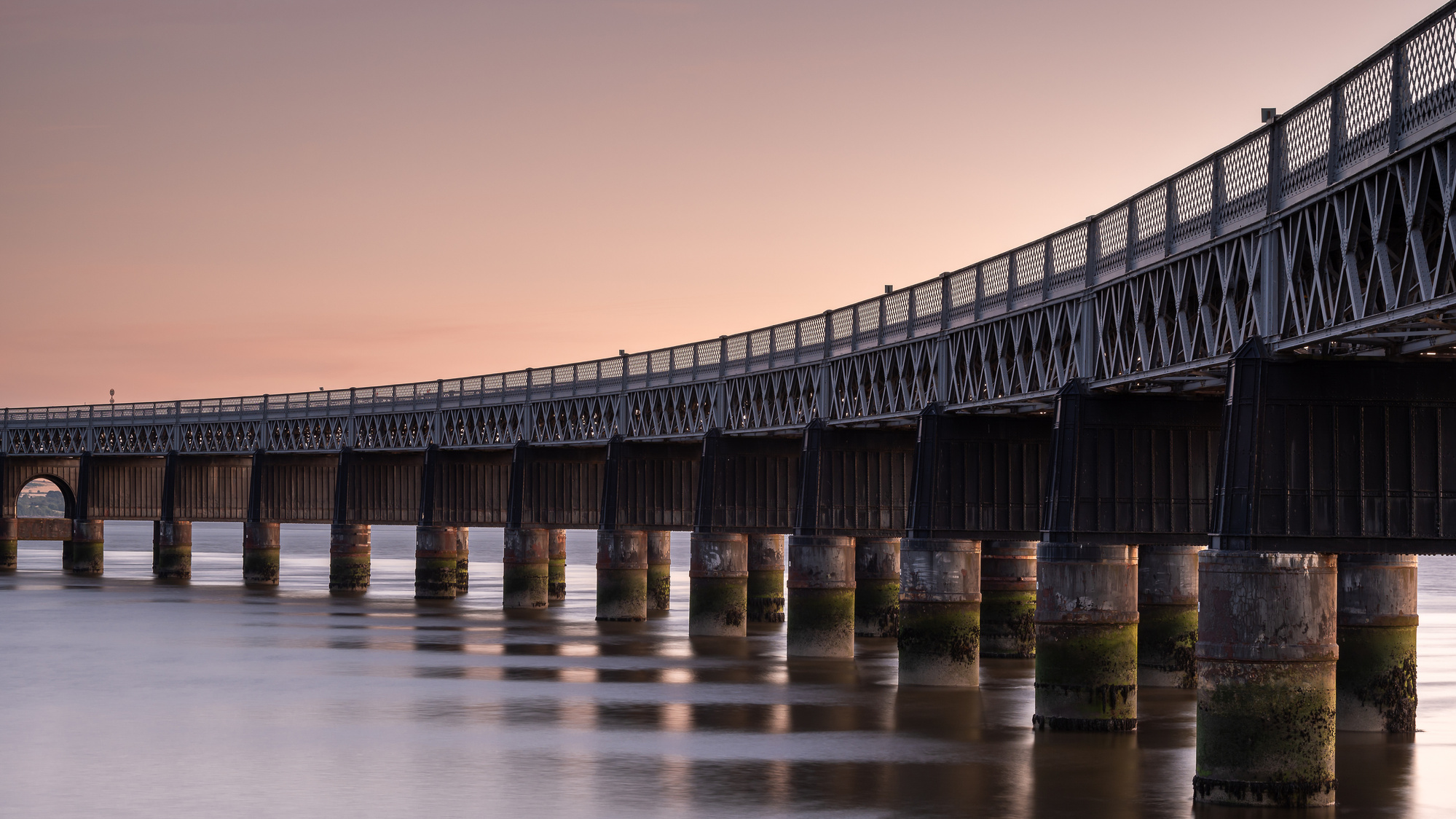 Late evening light hits the Tay Rail Bridge, Dundee, Scotland. A photograph by Tim Pearson.