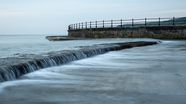 High tide washes over the old lido at South Bay, Scarborough. A photograph by Tim Pearson.