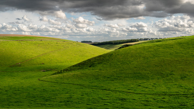 Sunlight and shadows fall on Camp Dale on the Yorkshire Wolds Way. A Photograph by Tim Pearson.