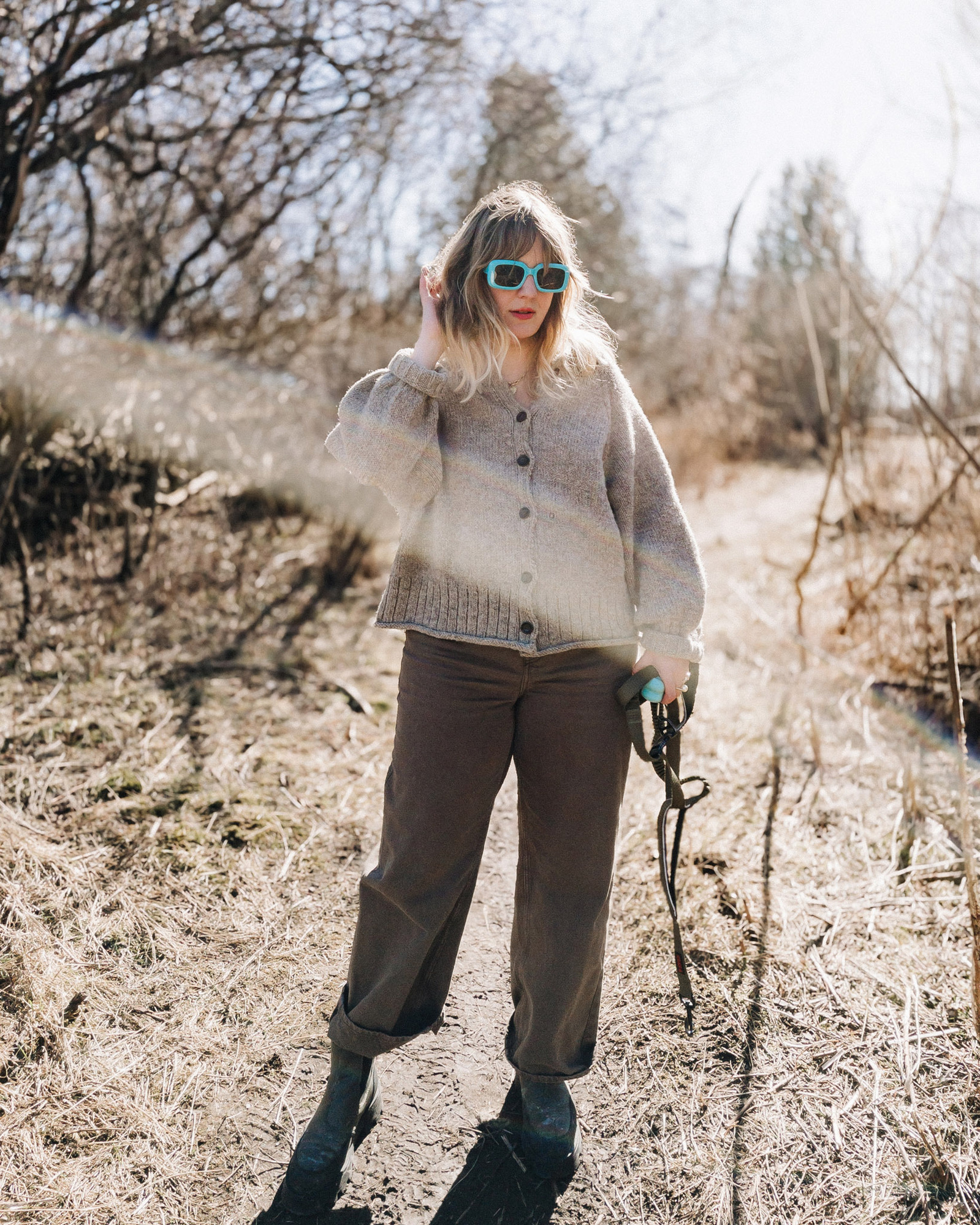 a fashion portrait of Anne-Sophie Lambell modelling a sweater that she knit while out walking her dog.