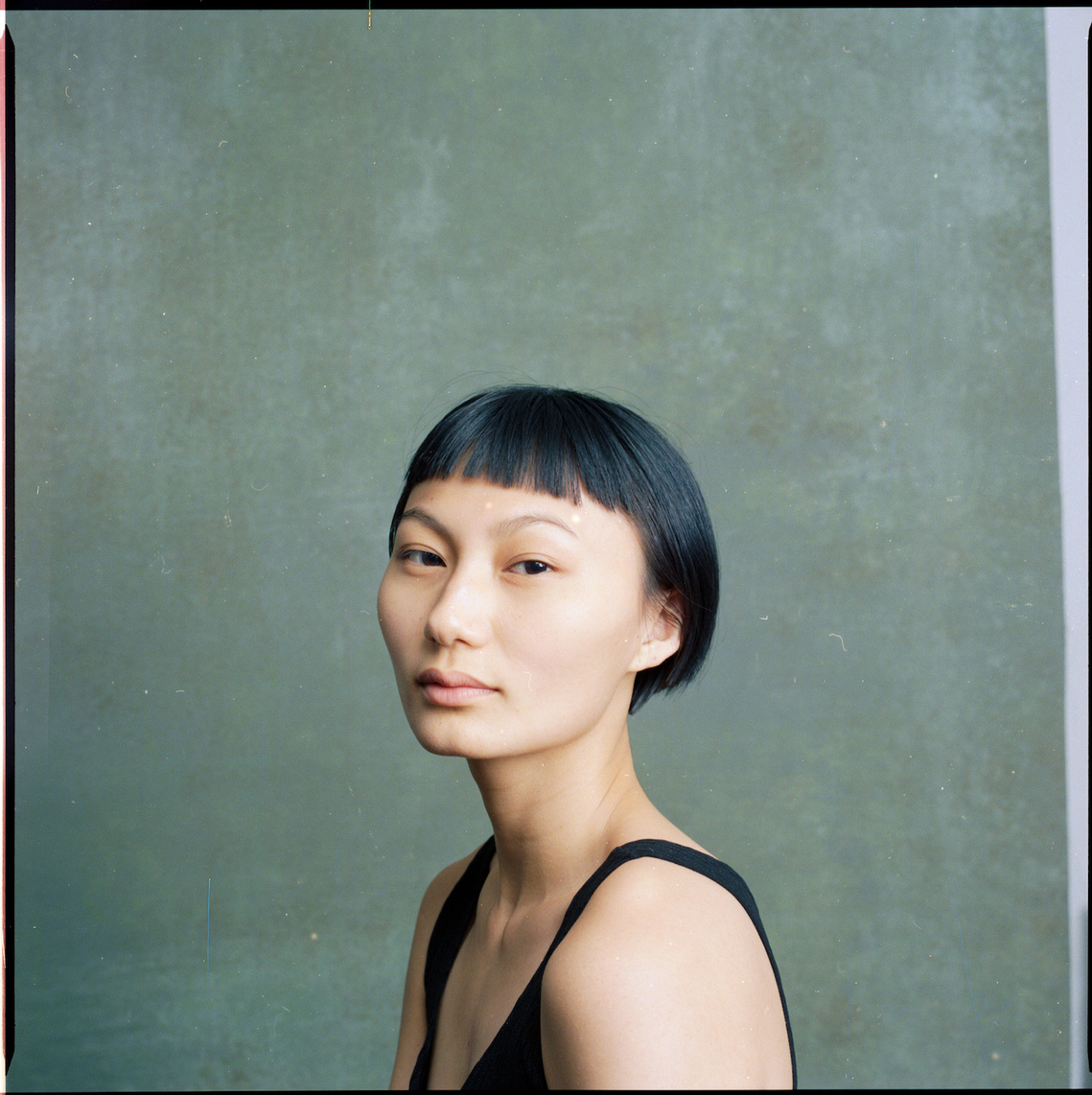 A portrait of photographer and model Eve Liu. New York photographer and model Eve J. Liu on 120 film. 