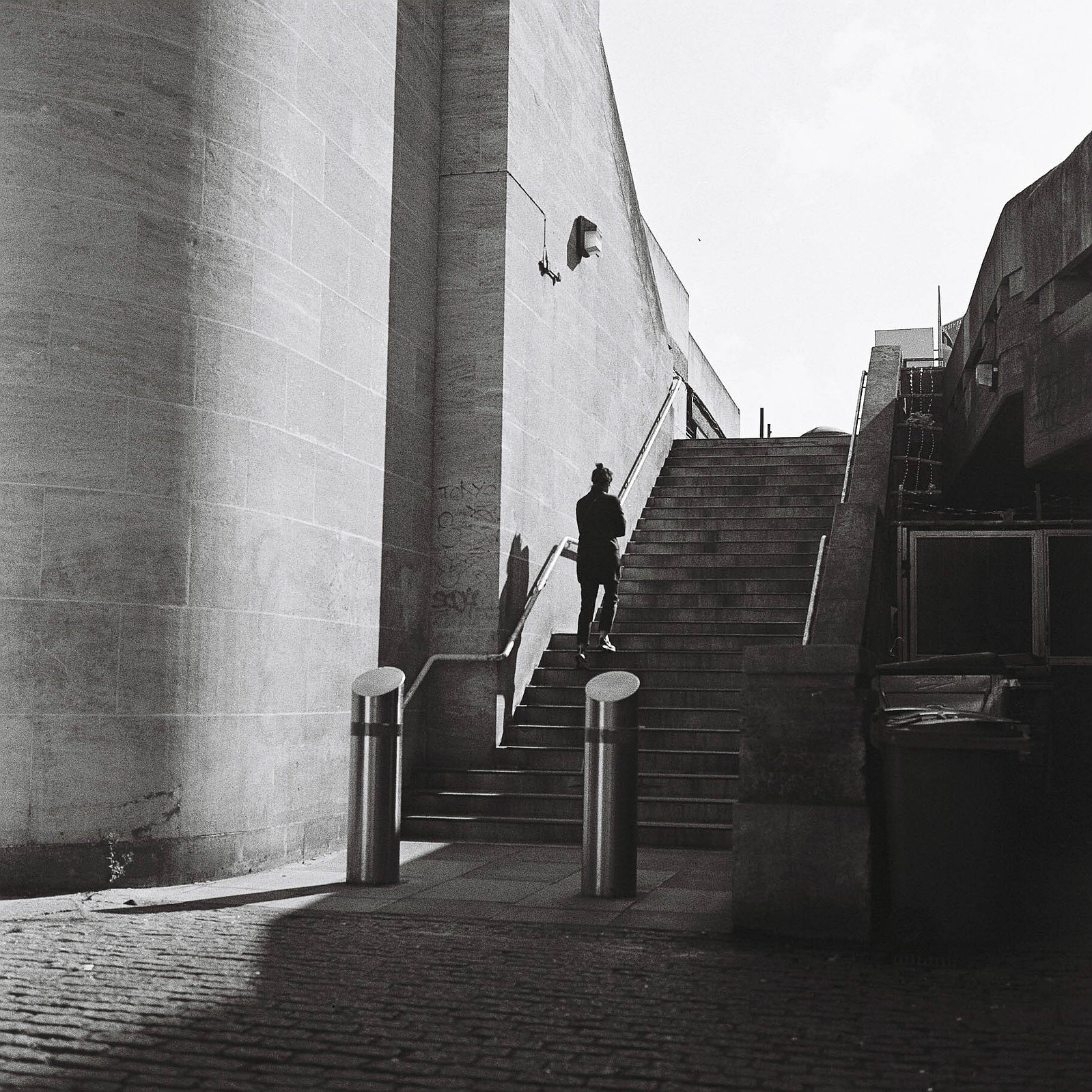 A woman climbs the stairs
