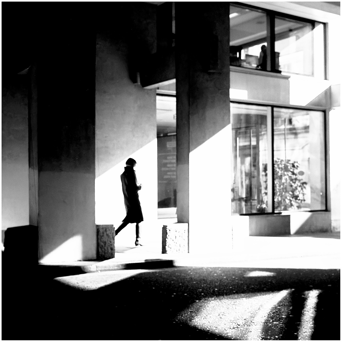 A figure walking through light.