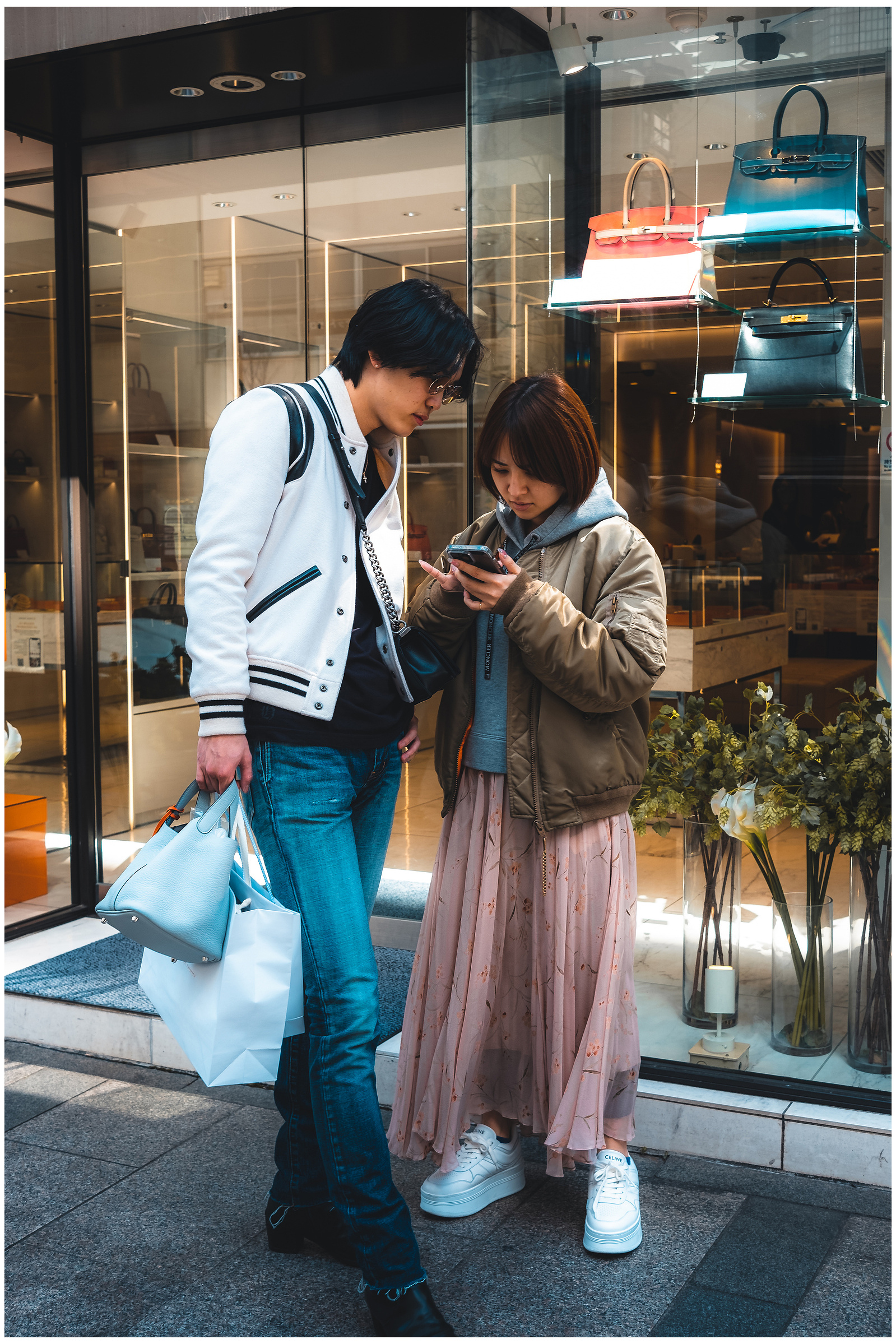 The vibrant energy of Tokyo's Ginza district is palpable, with its colorful storefronts and lively crowds creating a dynamic scene that perfectly captures the city's spirit. #Ginza #TokyoCityLife #StreetPhotography #JapanTravel #UrbanExploration