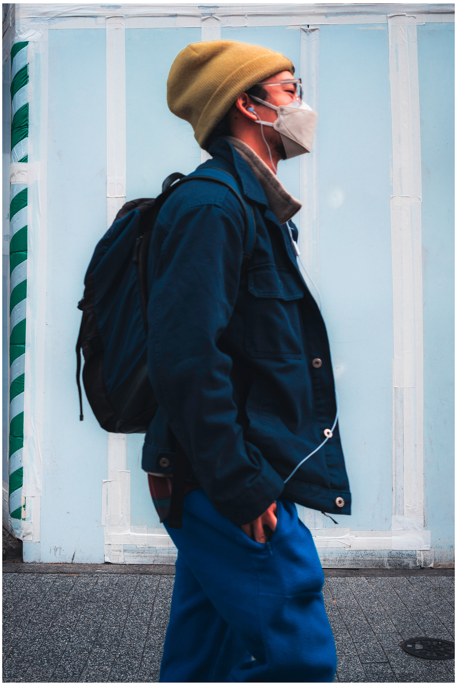A well dressed man in a face mask