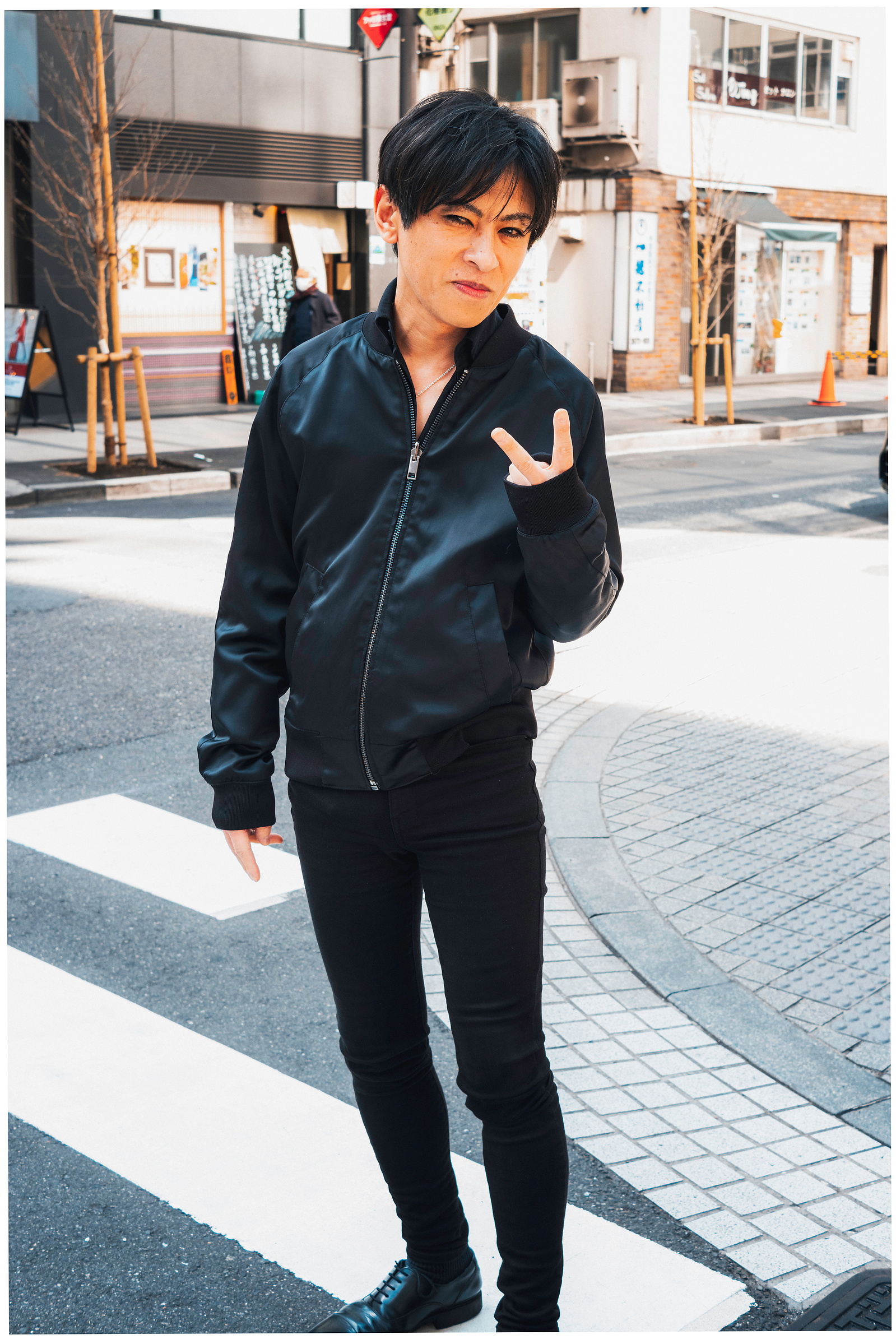 A man with two fingers up at the camera