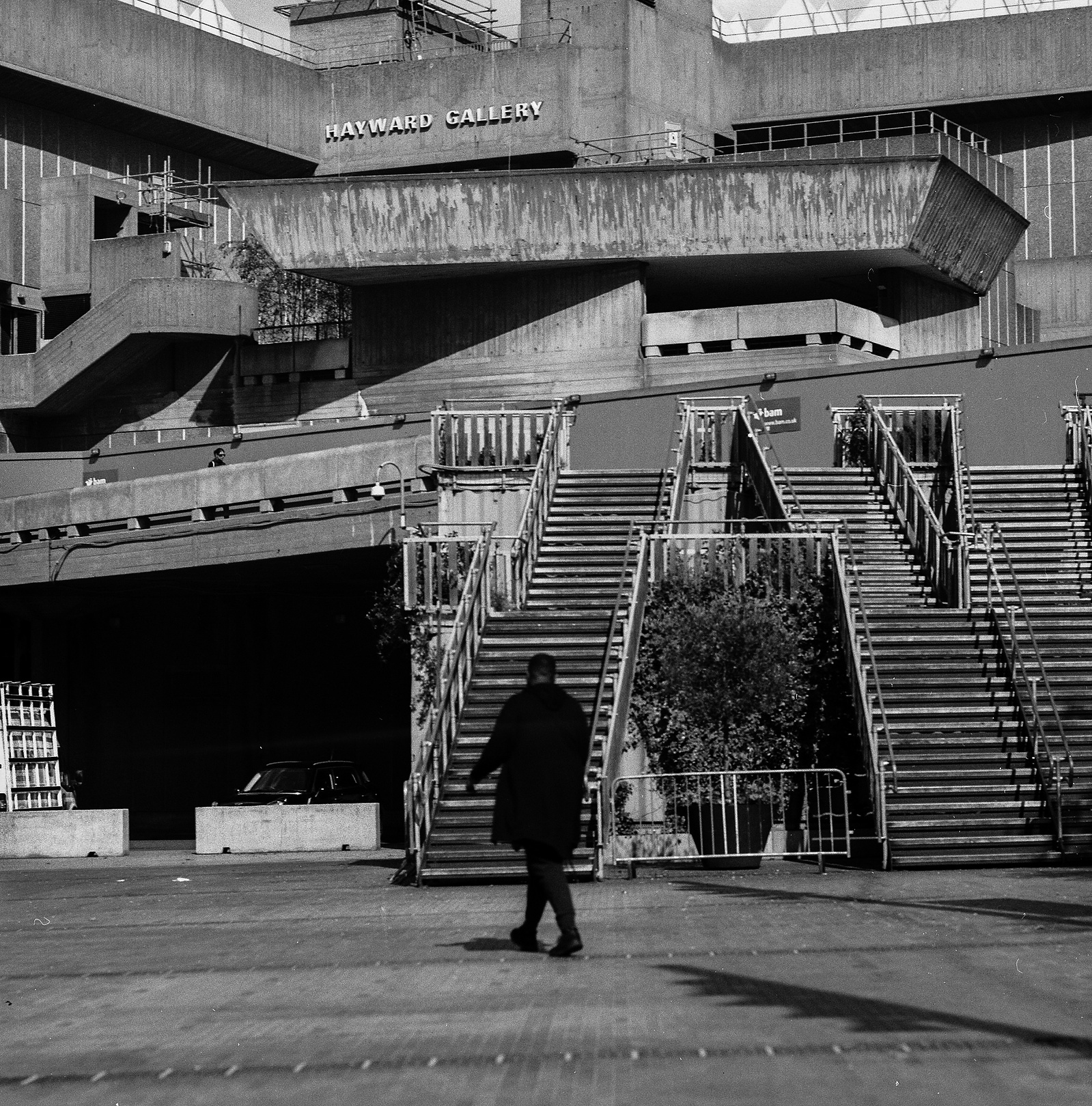 A man walks past some stairs