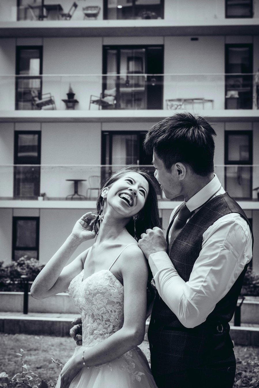 candid and natural wedding photography, city centre urban wedding, wedding couple portrait laughing 