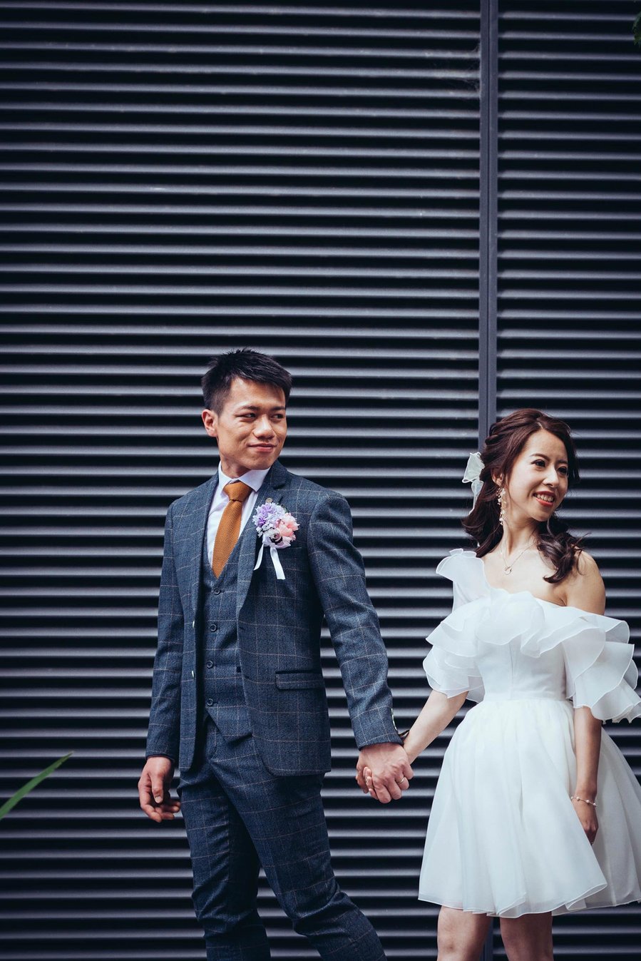 candid and natural wedding photography, city centre urban wedding, groom holds umbrella, black and white