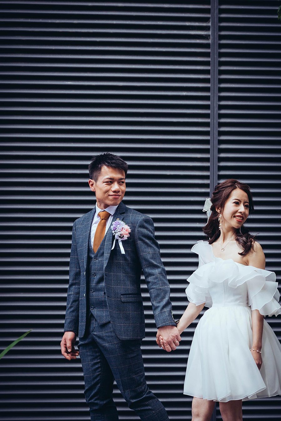 candid and natural wedding photography, city centre urban wedding, groom holds umbrella, black and white