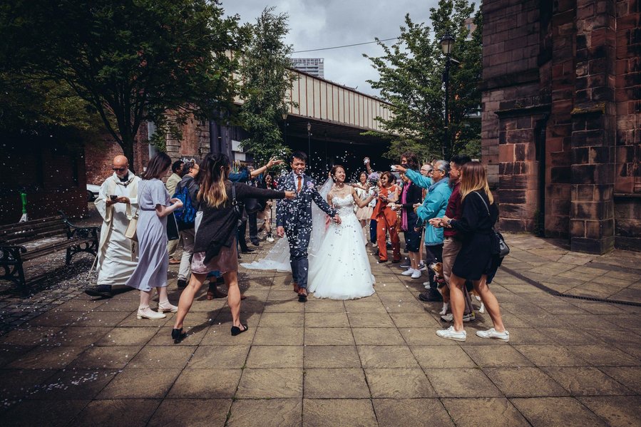 candid and natural wedding photography, city centre urban wedding, natural shot of bride from behind as she looks down