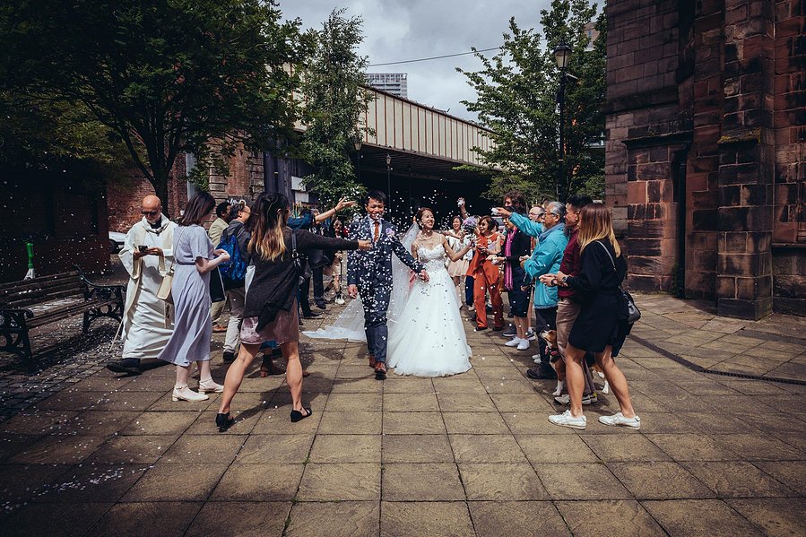 candid and natural wedding photography, city centre urban wedding, natural shot of bride from behind as she looks down