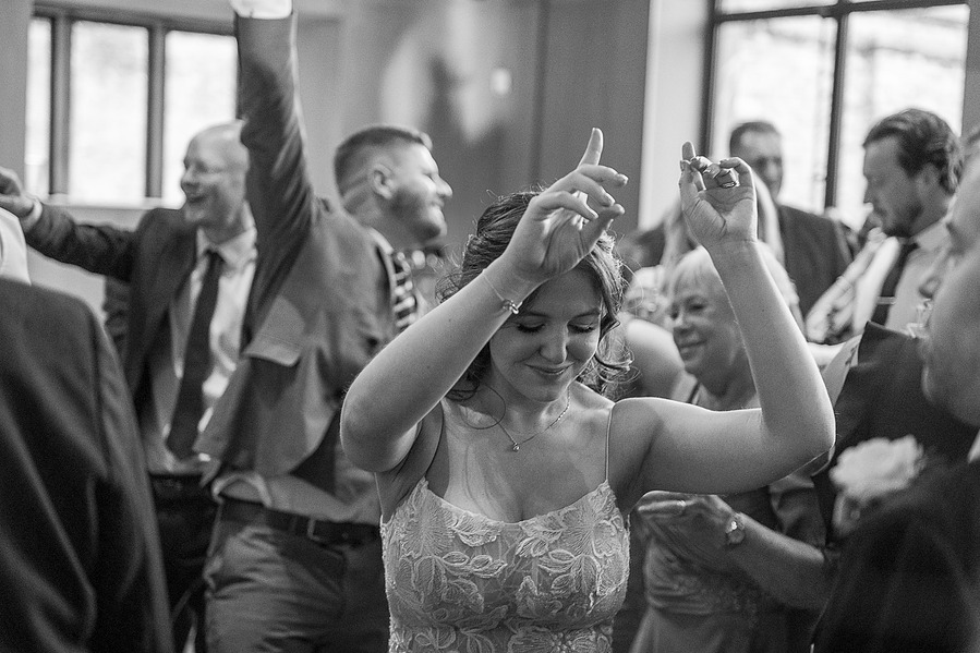 natural and authentic wedding photography, bride on dance floor at wedding