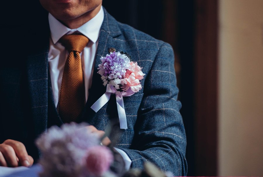 candid and natural wedding photography, city centre urban wedding, cropped shot of groom in suit