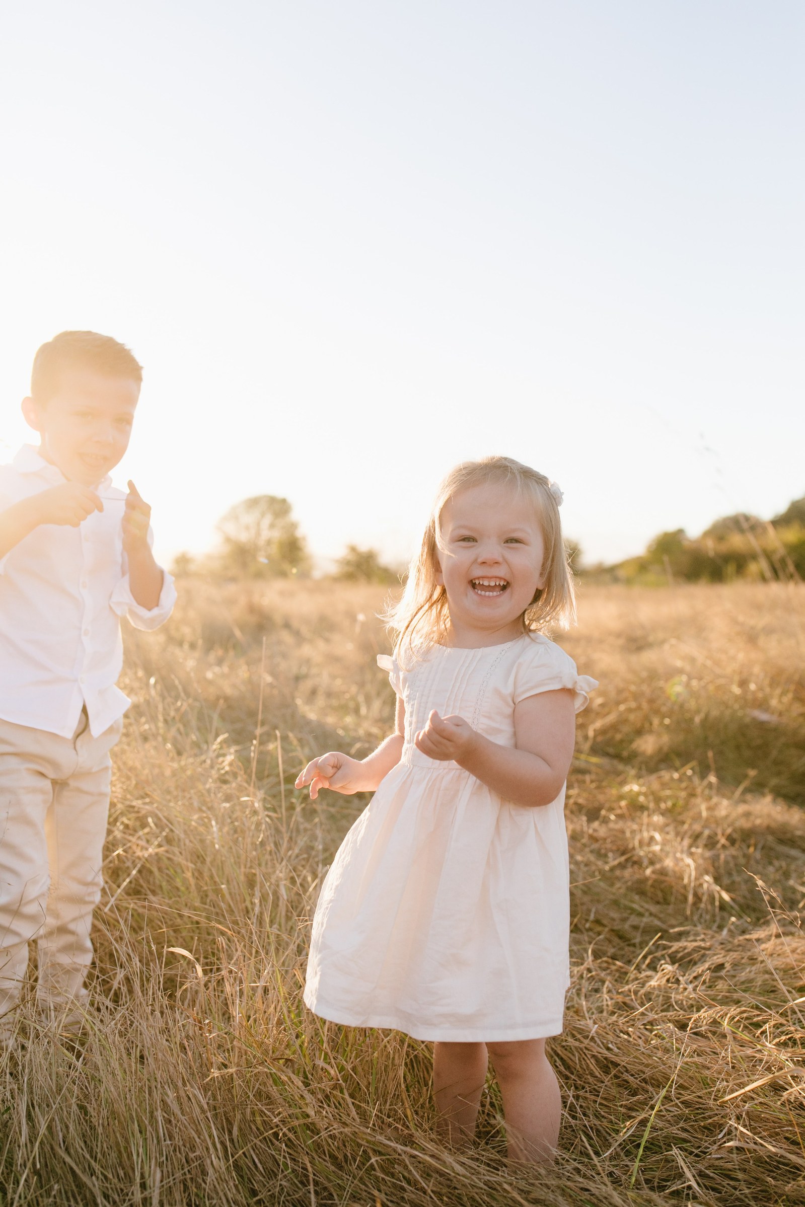 Family mini-session portraits at Discovery Park in Seattle all summer long in golden natural light