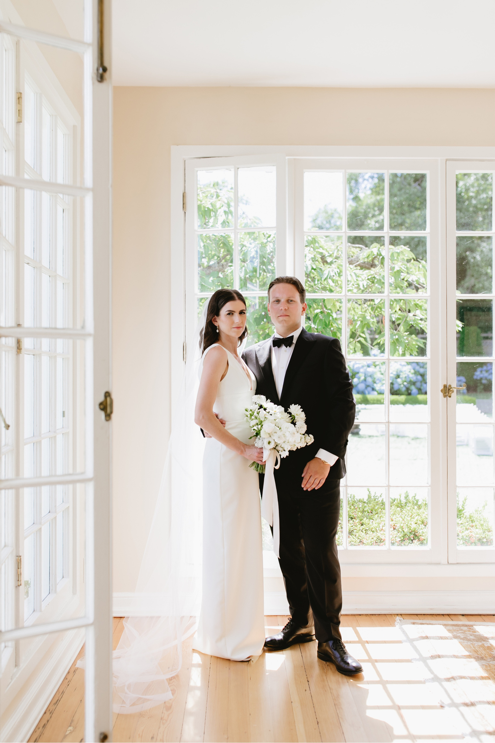Classic black tie wedding with whimsical florals by Iris & Fig and planning by Eventful Moments. Breathtaking classic bridal details and decor with a view of the Seattle Sound and Downtown from The Admiral's House