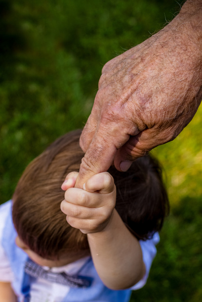 adorable baby photos of a baby holding their grandparents hand