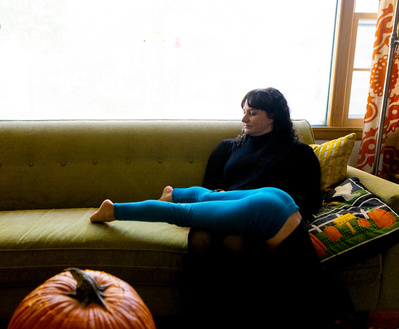 fall photos of a family relaxing on the couch in their home
